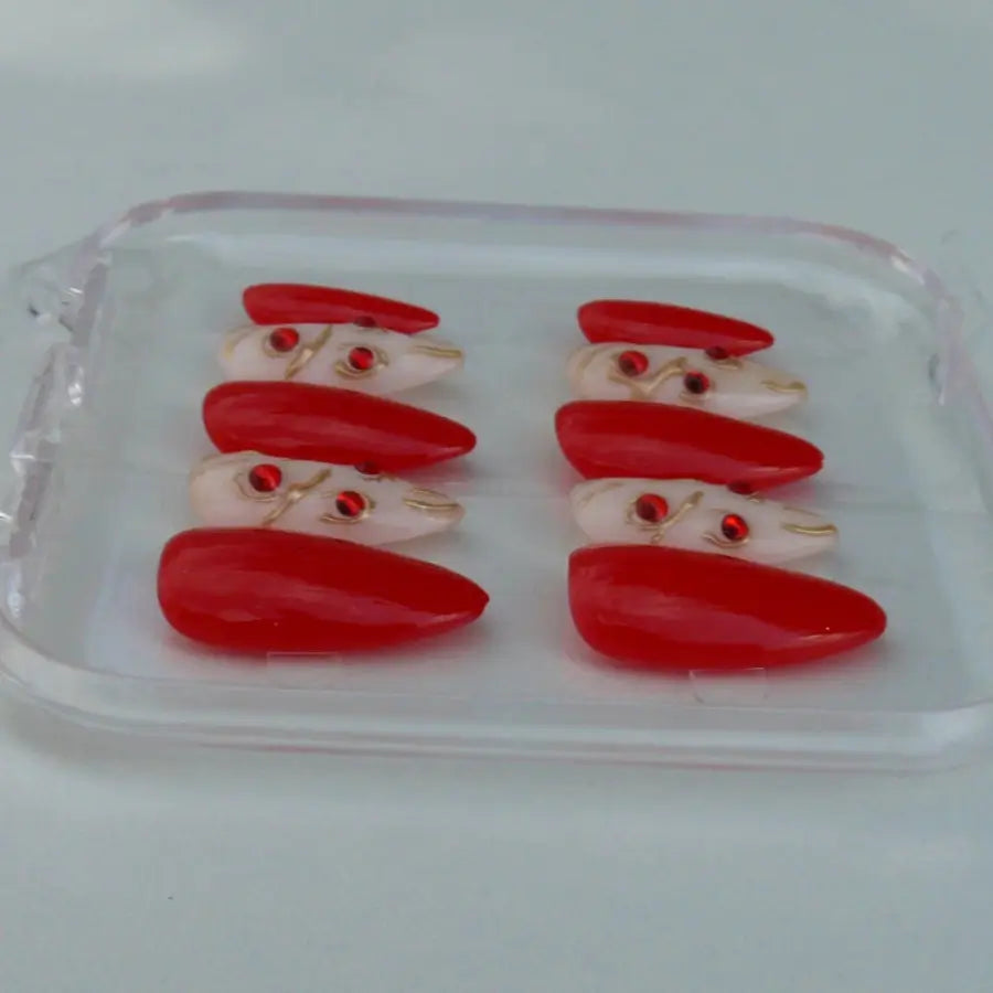 Ces faux ongles aux allures d'un joyau catalan blanc et rouge, majestueux